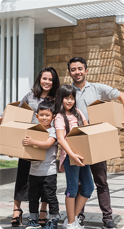family holding boxes and posing (1)