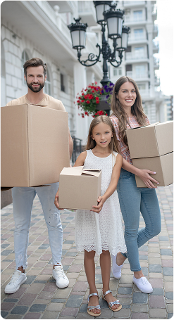 family holding boxes